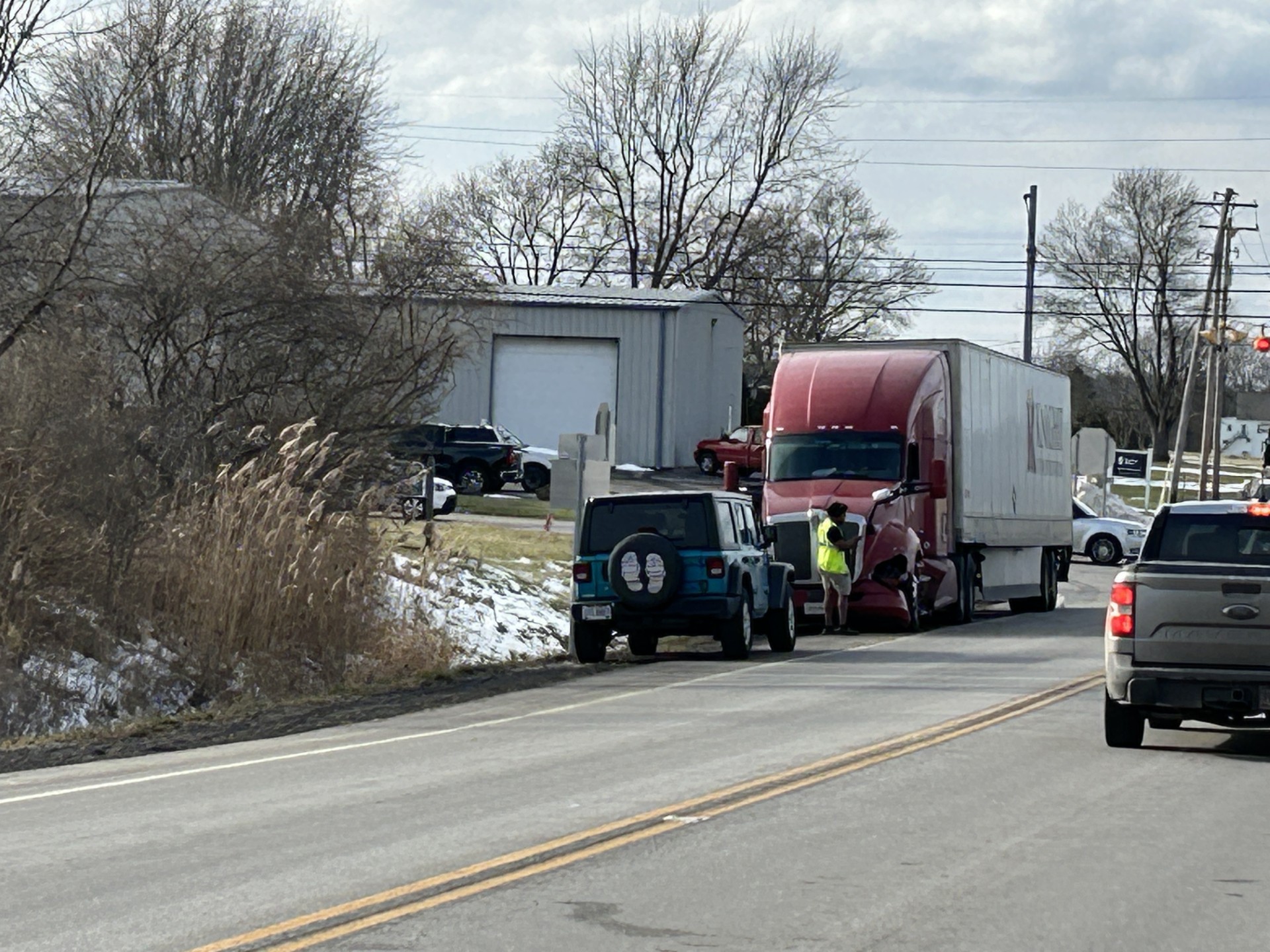Two injured after car collides with semi in Green Township